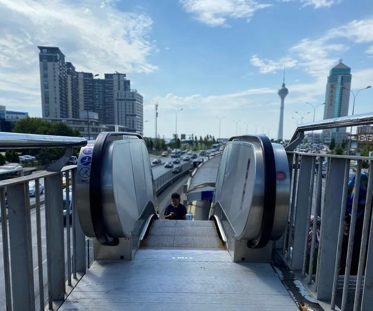 Escalator at a station footbridge
