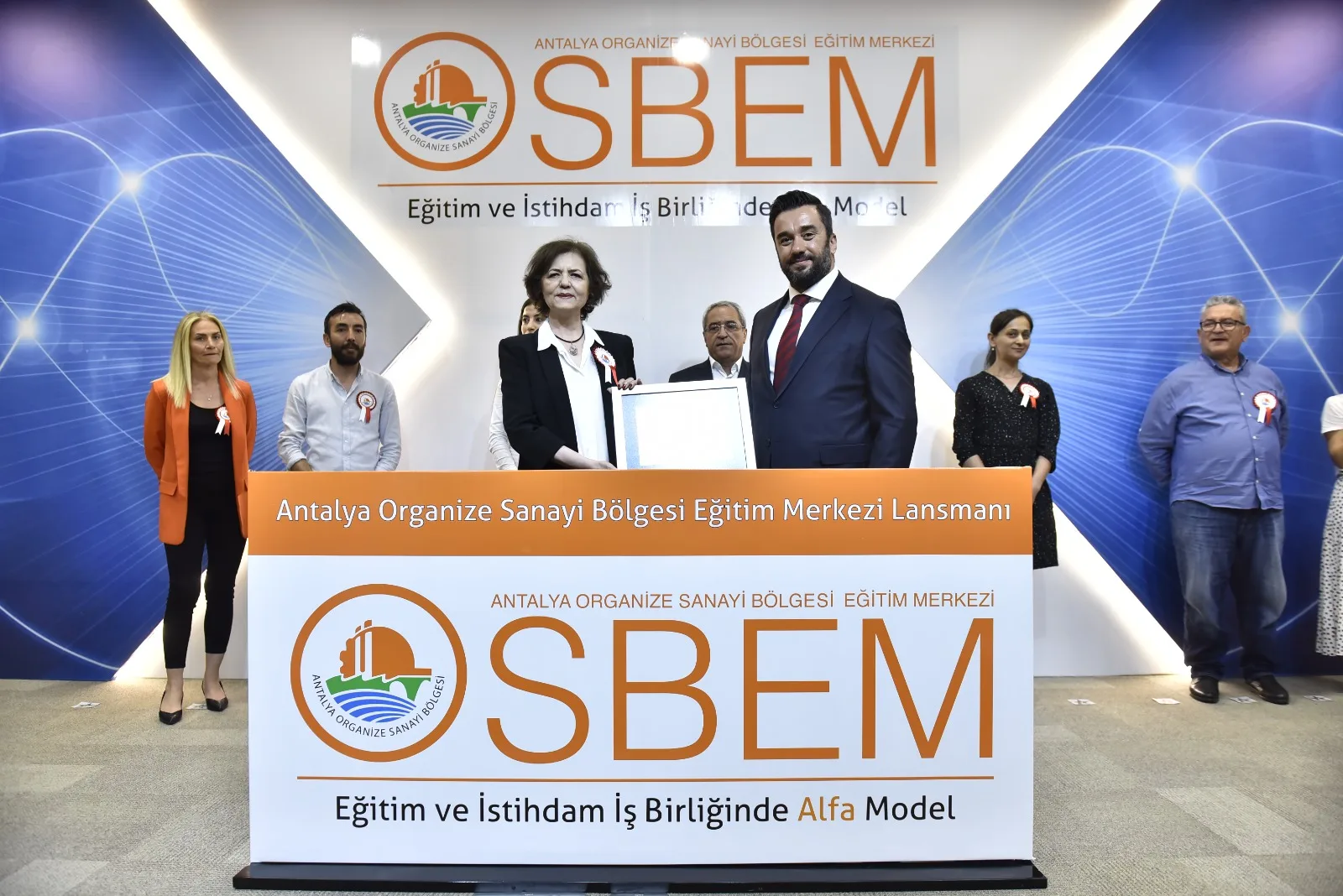 Participants on stage at the OSBEM event